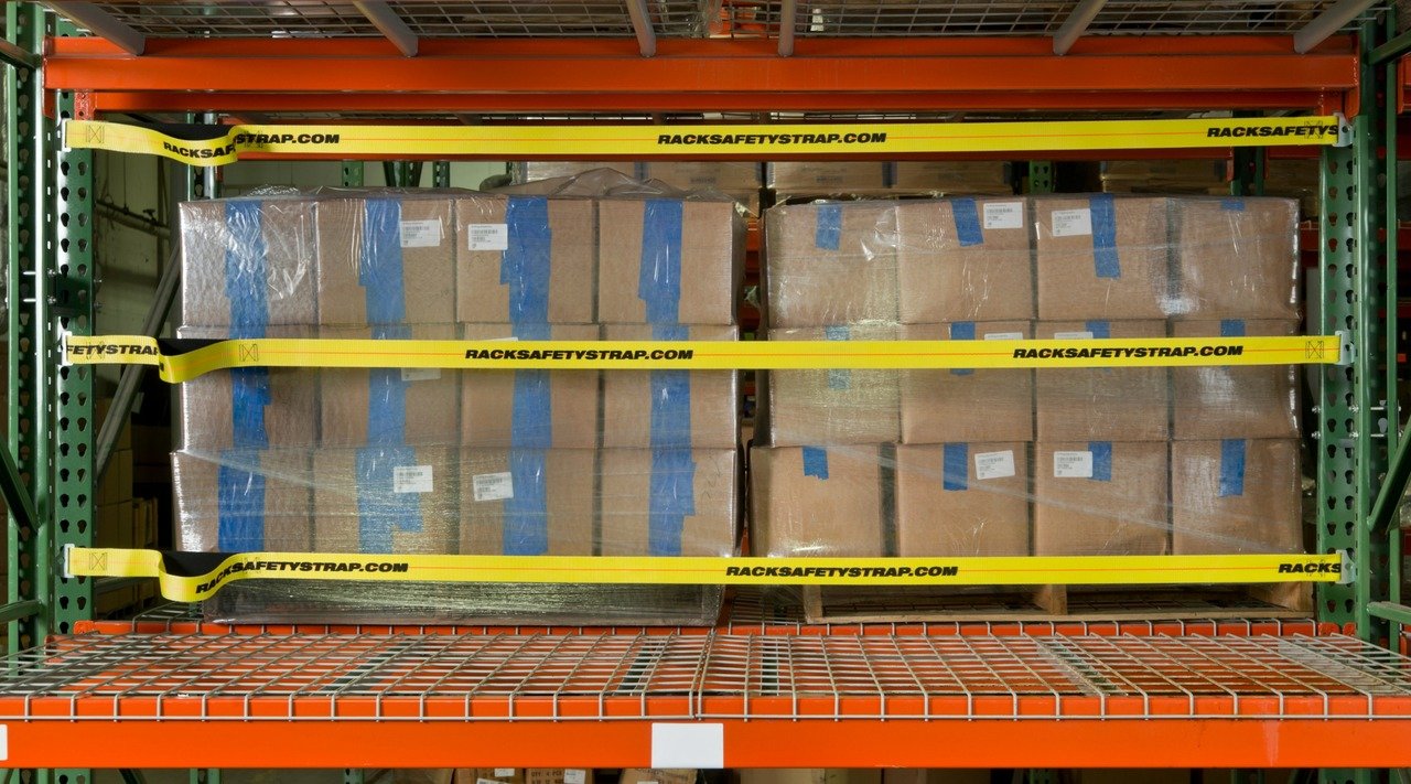 boxes on warehouse shelves with fixed safety net